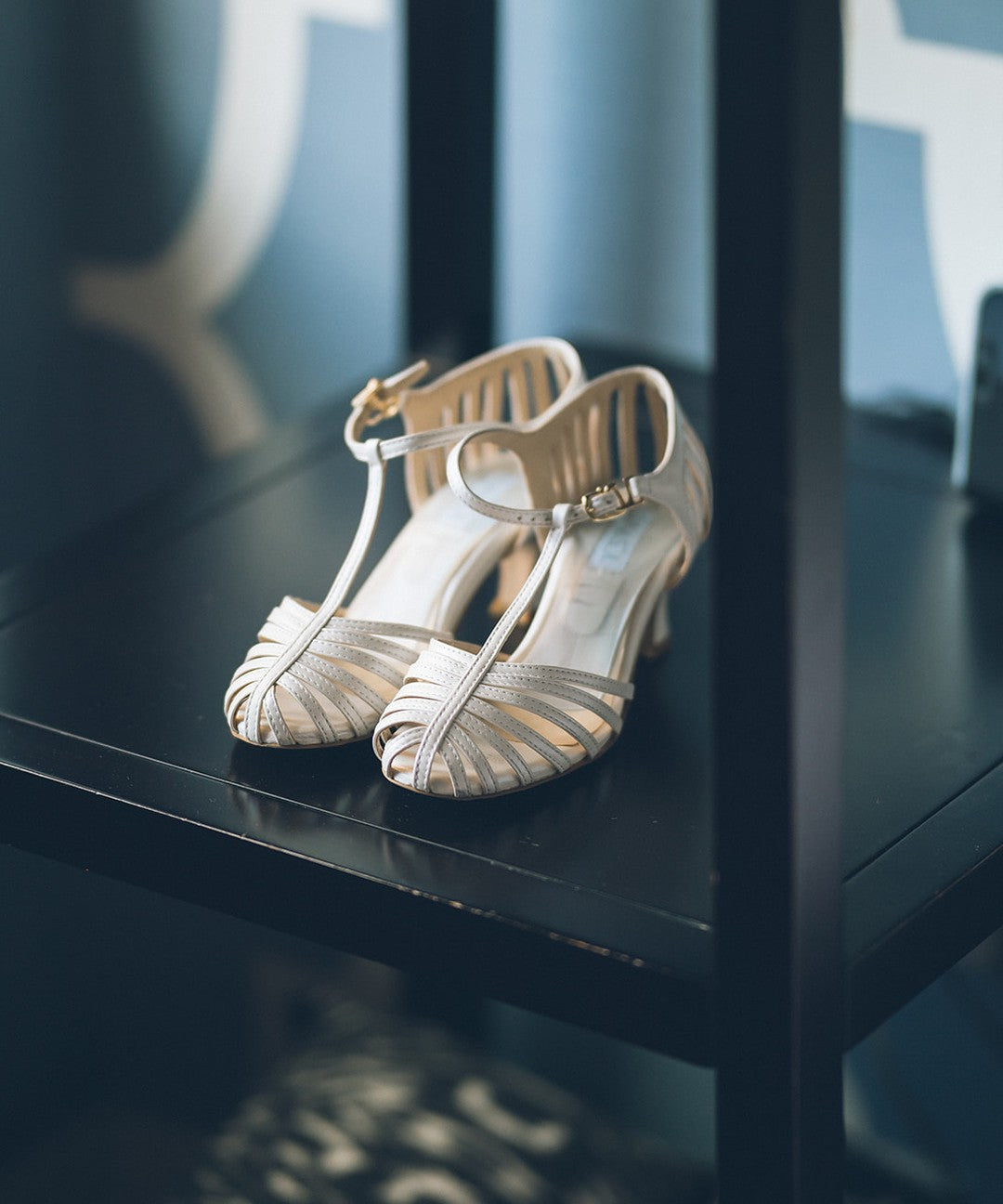 Hannah's LunaSol Caged Swing heels in the low heel, waiting on a table